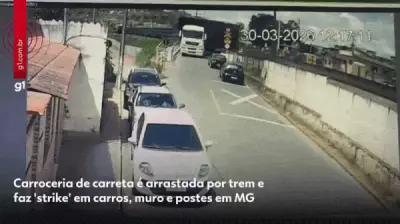 Carreta é arrastada por trem e causa destruição em série em Carandaí, Minas Gerais