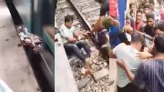 Pai salva filho ao pular nos trilhos de trem em Bangladesh; veja vídeo
