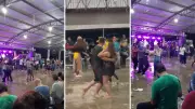 Chuva alaga baile no Paraná, mas público continua festa dançando na água