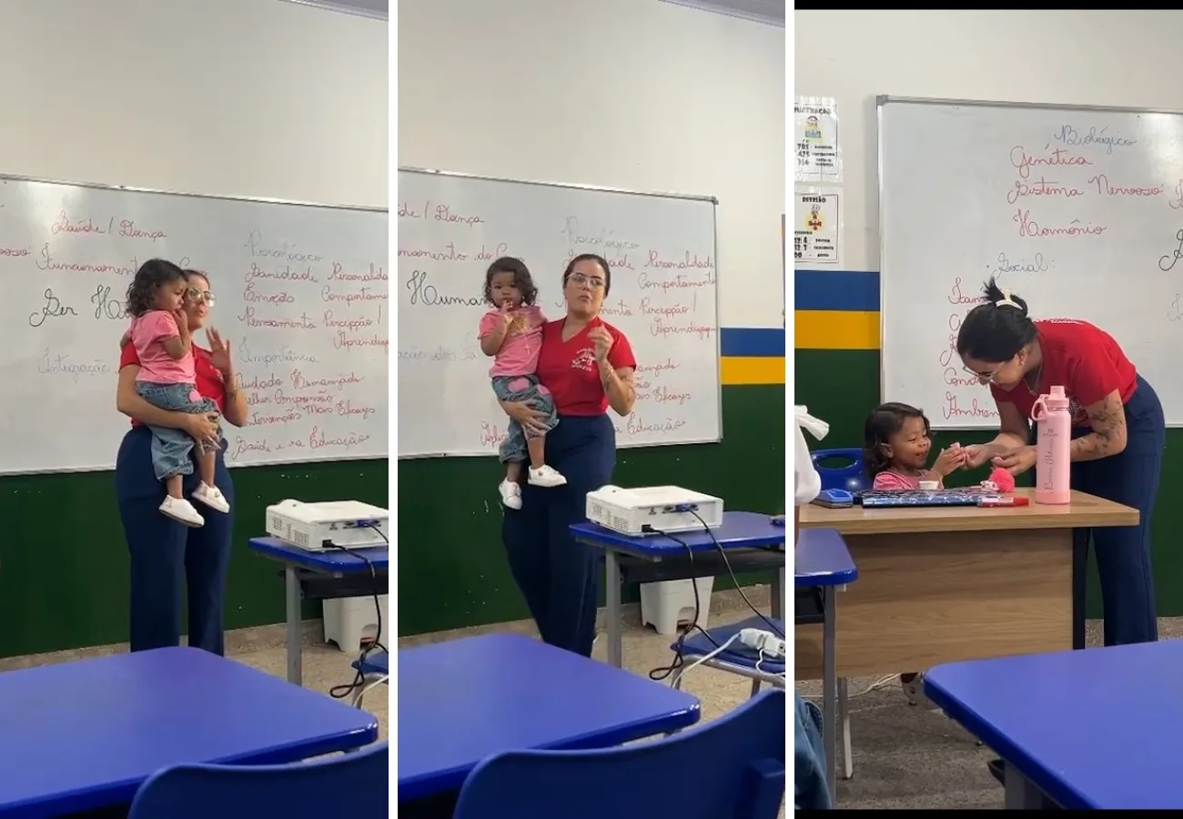 Professora segura filha de aluna no colo para que jovem possa assistir aula e viraliza