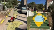 Comunidade em Porto Alegre pinta ruas para a Copa do Mundo