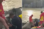 Homem fica preso em rochas ao tentar recuperar documentos em Santos, SP