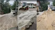 Rua vira cachoeira após reservatório transbordar em Florianópolis