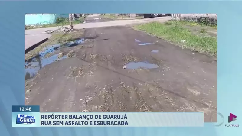 Rua esburacada e sem asfalto no Guarujá: moradores exigem solução urgente